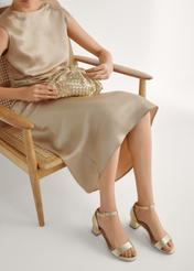 Жіночі золотисті шкіряні сандалі BUTYD-1179-2X(W26), вигляд виробу спереду на ногах моделі.