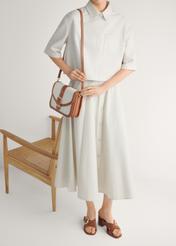 Жіночі замшеві мюлі на блочному каблуці BUTYD-1228-1D(W26), вигляд виробу спереду на ногах моделі, на світлому фоні.