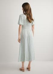 Довга сукня з шавлієвим квітковим принтом SUKDT-0191-8P(W26), вигляд виробу ззаду на моделі. Видно все тіло.