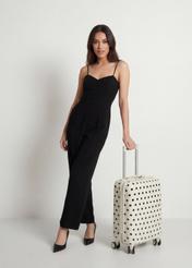 Маленька валіза в горошок на колесах WALAB-0074-0P-19(W26), діагональний вигляд виробу поруч із силуетом моделі.