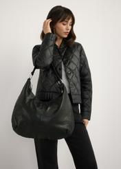 Чорна шкіряна жіноча сумка TORES-1242-99(W26), вигляд виробу на плечі моделі. Видно половину силуету.