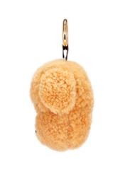 Коричневий брелок у формі собаки BRELOK-210A-81(Z25), вигляд виробу збоку на білому фоні.