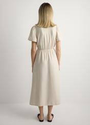 Жіноча світло-бежева сукня SUKDT-0255-1A(W26), вигляд виробу ззаду на моделі. Видно все тіло.