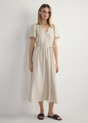 Жіноча світло-бежева сукня SUKDT-0255-1A(W26), вигляд виробу спереду на моделі. Видно все тіло.