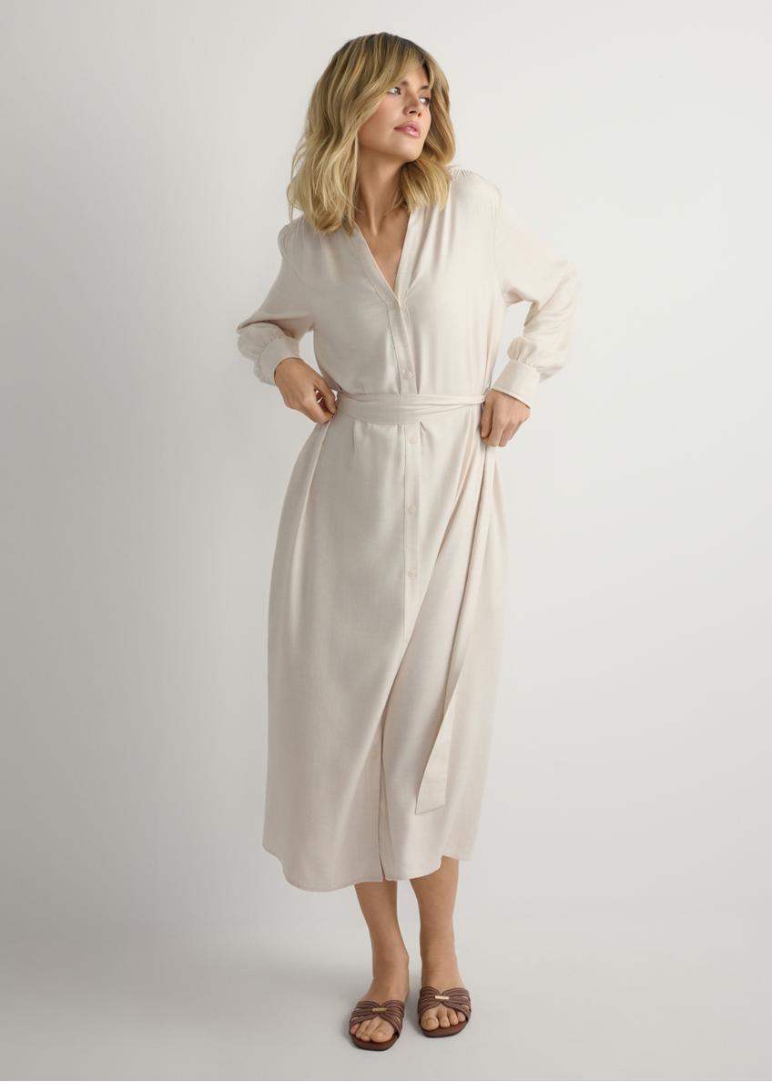 Світло-бежева жіноча сукня міді SUKDT-0269-1A(W26), вигляд виробу спереду на моделі. Видно половину силуету.